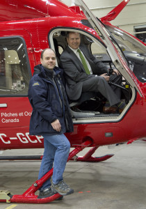 MP Darren Fisher inspects new Light-Lift helicopter with Jim Myra, Regional Supervisory Helicopter Pilot from Transport Canada.