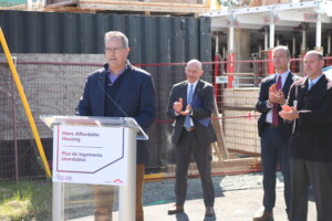 Photo of MP Fisher announcing housing funding